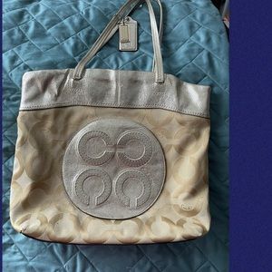 Used gold coach bag.